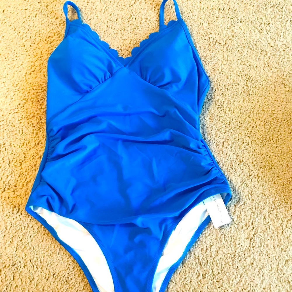 Cupshe one piece, scallop design at top.